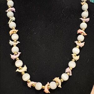 Vintage cats eye with carved dolphins necklace